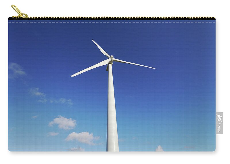 Outdoors Zip Pouch featuring the photograph Wind Turbine Against Blue Sky by Tom Bonaventure