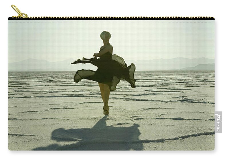 Ballet Dancer Zip Pouch featuring the photograph Woman Dancing In Desert At Sunrise by Photodisc