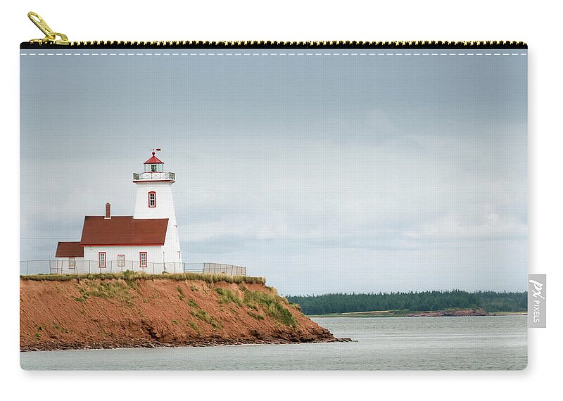 Water's Edge Zip Pouch featuring the photograph Wood Islands Lighthouse by Westhoff