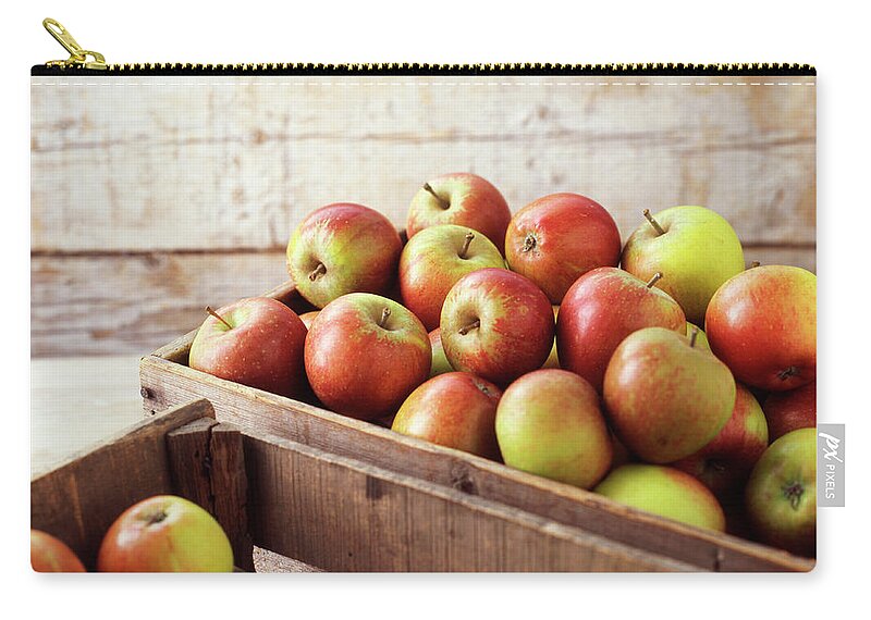 Large Group Of Objects Zip Pouch featuring the photograph Wooden Crates Of Organic Apples by Diana Miller