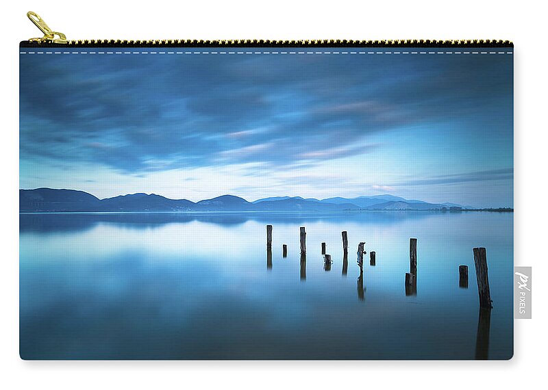 Lake Zip Pouch featuring the photograph Lake and Jetty Remains after Sunset by Stefano Orazzini