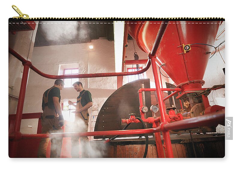 Expertise Zip Pouch featuring the photograph Workers In Brewery With Sample by Monty Rakusen