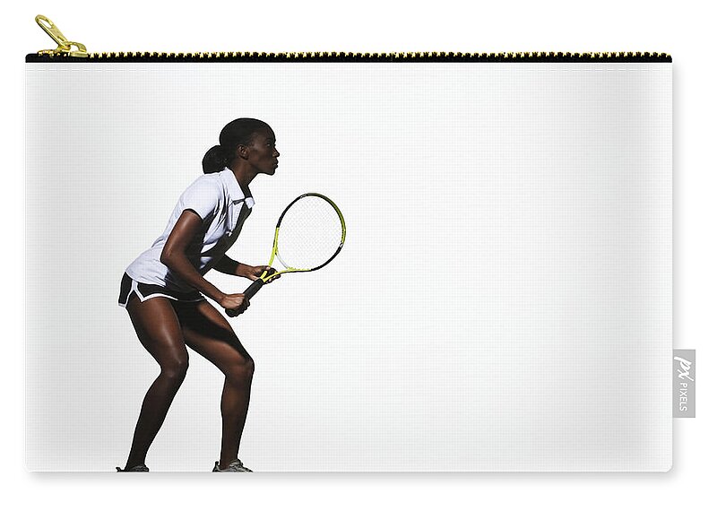 Tennis Zip Pouch featuring the photograph Young Woman Playing Tennis, Side View by Paul Taylor