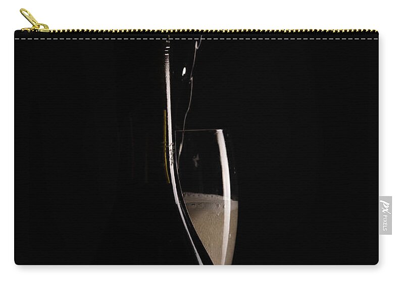 Red Wine Zip Pouch featuring the photograph Red sparking wine on a wineglass and black wine bottle. by Michalakis Ppalis