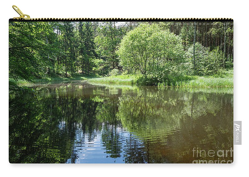 Forest Zip Pouch featuring the photograph Reflection of trees in calm water #2 by Adriana Mueller