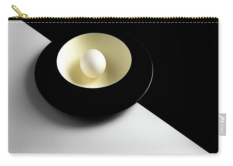 Still-life Zip Pouch featuring the photograph Single fresh white egg on a yellow bowl by Michalakis Ppalis