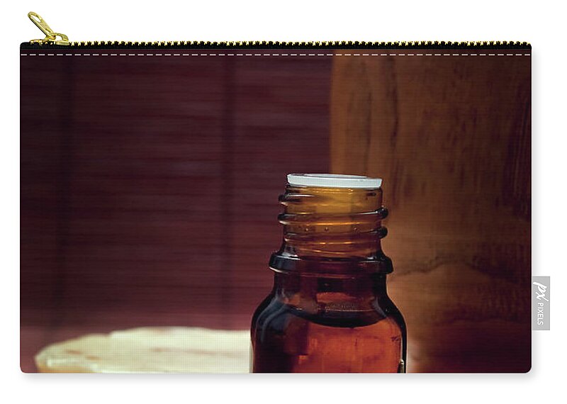 Spa Zip Pouch featuring the photograph Spa Essence Oil Closeup by Jelena Jovanovic