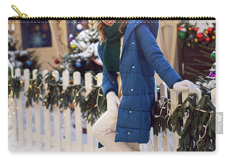 woman in a blue jacket and a green scarf and white gloves stands in winter  on square in Moscow on Christmas Day #2 Zip Pouch by Elena Saulich - Fine  Art America
