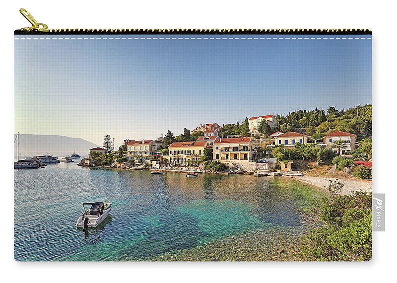 Fiscardo Zip Pouch featuring the photograph The port of Fiskardo in Kefalonia, Greece #3 by Constantinos Iliopoulos
