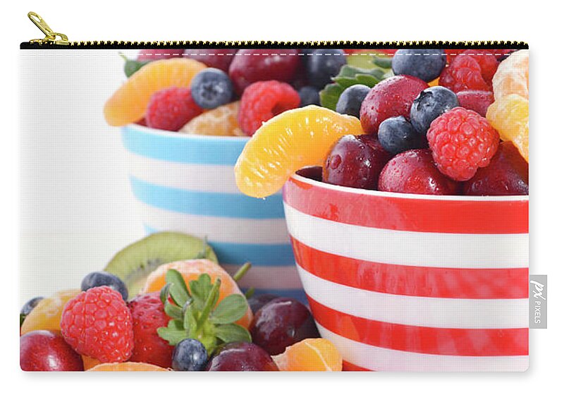 Blue Zip Pouch featuring the photograph Fresh colorful fruit in breakfast bowls #4 by Milleflore Images