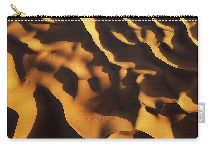 Aerial Zip Pouch featuring the photograph Aerial top view on sand dunes in desert #8 by Mikhail Kokhanchikov