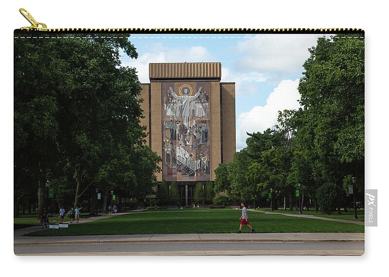 Notre Dame Fighting Irish Zip Pouch featuring the photograph Wide view of Touchdown Jesus World of Life Mural University of Notre Dame by Eldon McGraw