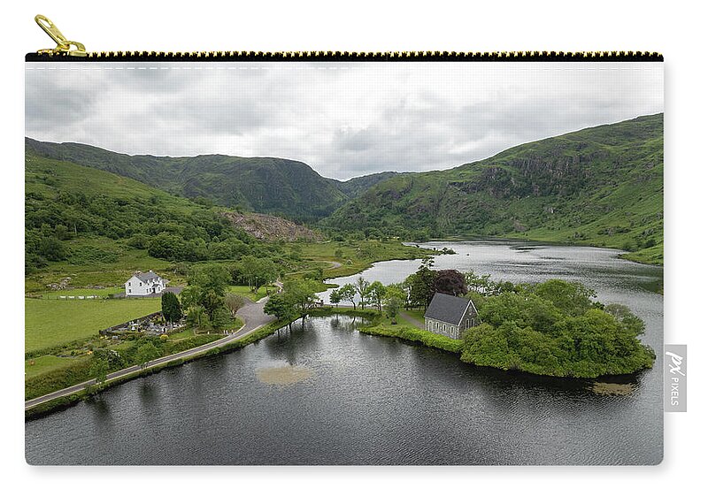 Saint Finbarr Oratory Carry-all Pouch featuring the photograph Aerial drone landscape of St. Finbarr oratory Church, Gougane Barra, cork West Ireland. by Michalakis Ppalis