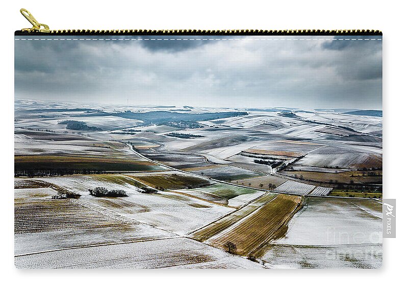 Above Carry-all Pouch featuring the photograph Aerial View Of Winter Landscape With Remote Settlements And Snow Covered Fields In Austria by Andreas Berthold