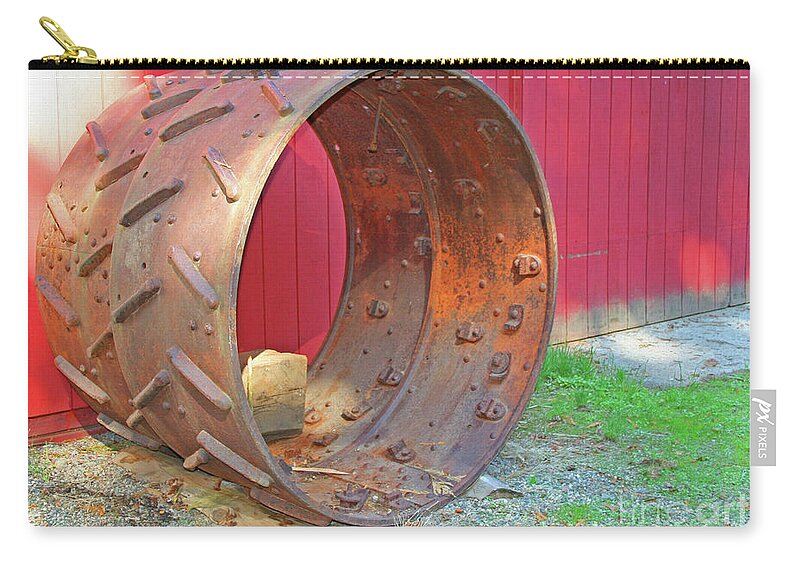 Antique Metal Tractor Wheels By Norma Appleton Zip Pouch featuring the photograph Antique Metal Tractor Wheels by Norma Appleton