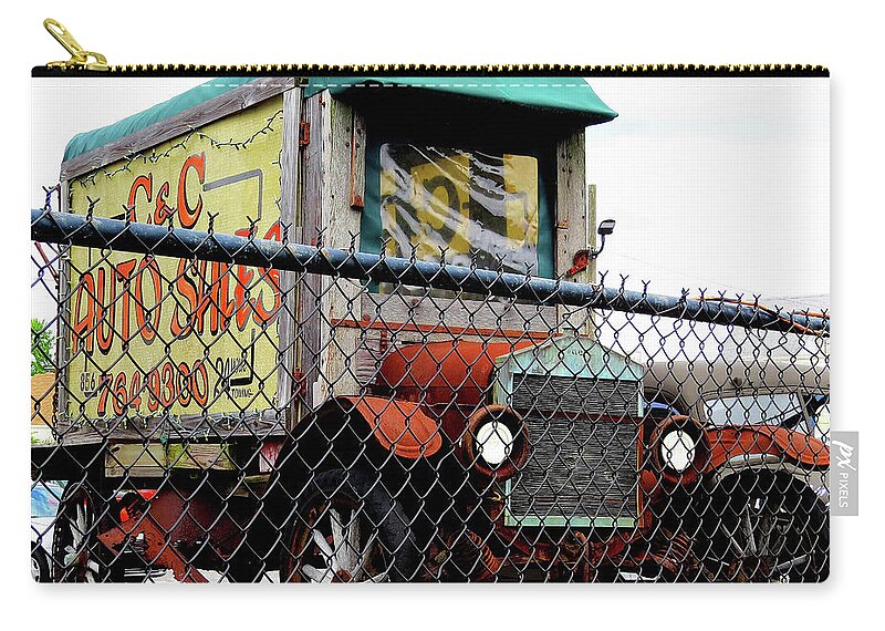 Antique Trucks Zip Pouch featuring the photograph Antique Truck Advertising Sign for Classic Auto Sales Lot by Linda Stern