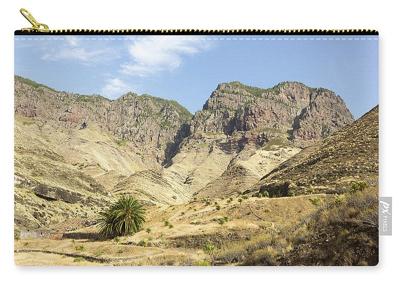 Mountain Zip Pouch featuring the photograph Arid rocky mountain by Josu Ozkaritz