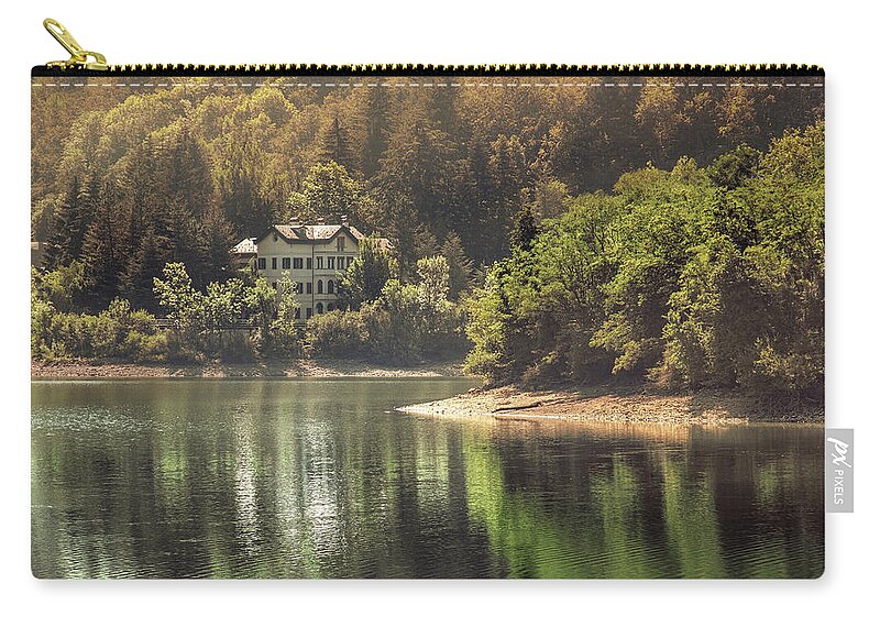 Autumn Zip Pouch featuring the photograph Autumn Lake Warm Tones View Building With Reflections On Water by Luca Lorenzelli