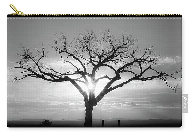 Taos Zip Pouch featuring the photograph B and W shot of the Taos Welcom Tree by Elijah Rael