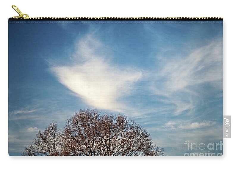 Sky Zip Pouch featuring the photograph Beautiful swirls of clouds on a blue sky above trees by Mendelex Photography