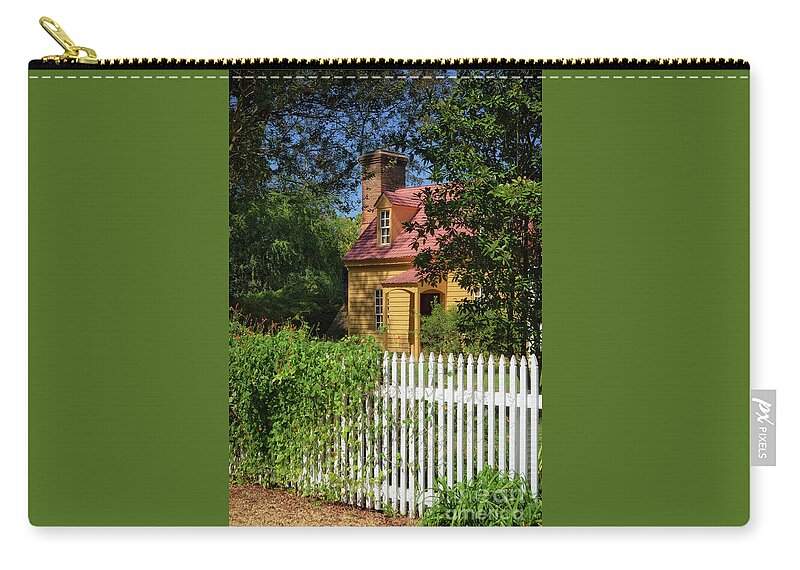 Colonial Williamsburg Zip Pouch featuring the photograph Behind The White Picket Fence by Lois Bryan