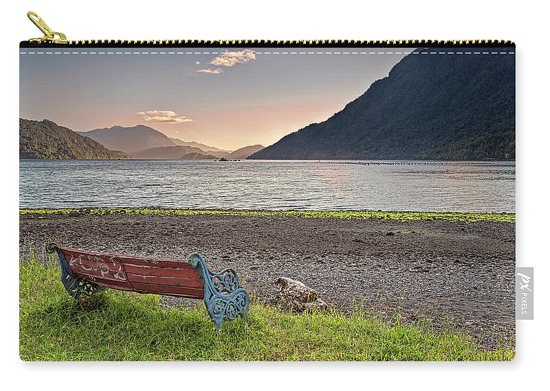 Chili Zip Pouch featuring the photograph Bench with a peacefull view on the Hornopiren fjord on sunset by Henri Leduc