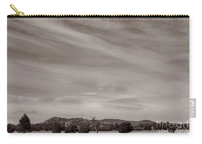 Landscape Zip Pouch featuring the photograph Between the Pylons by Linda Lees