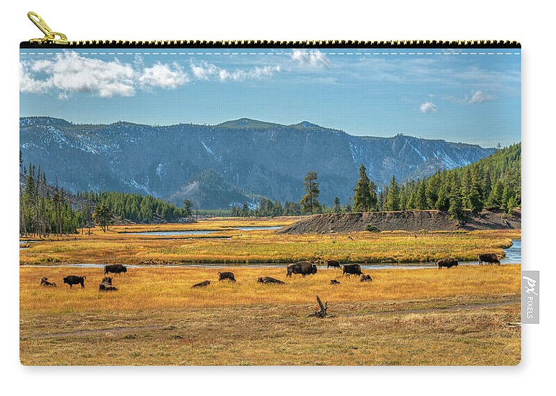 Yellowstone Carry-all Pouch featuring the photograph Bison Roaming Madison River in Yellowstone by Kenneth Everett