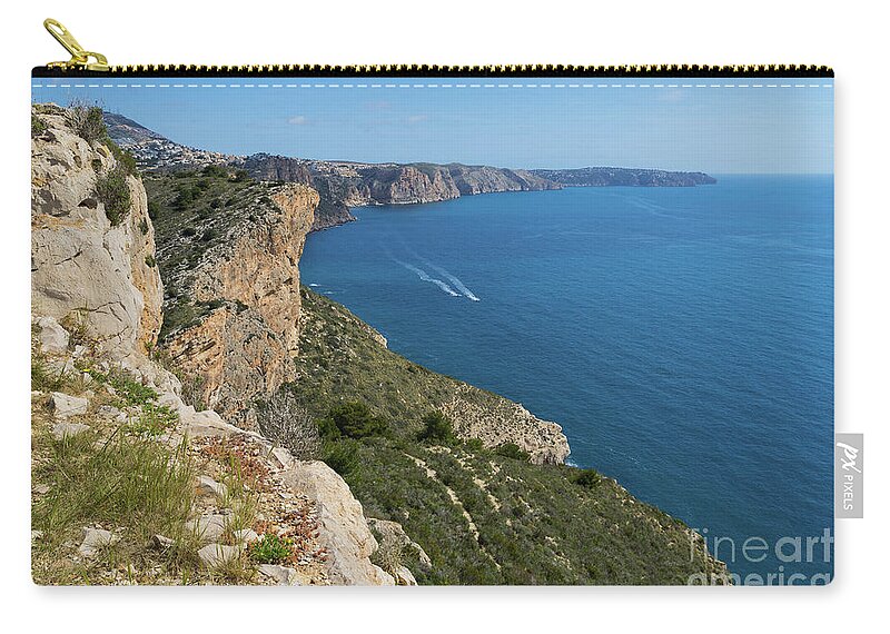 Mediterranean Sea Zip Pouch featuring the photograph Blue Mediterranean Sea and limestone cliffs by Adriana Mueller