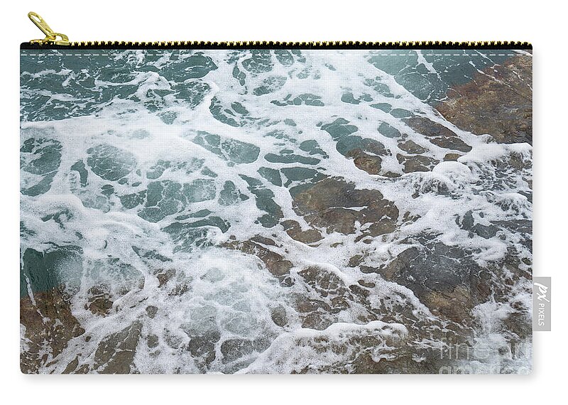 Sea Water Zip Pouch featuring the photograph Blue sea water flows over the rocks 3 by Adriana Mueller