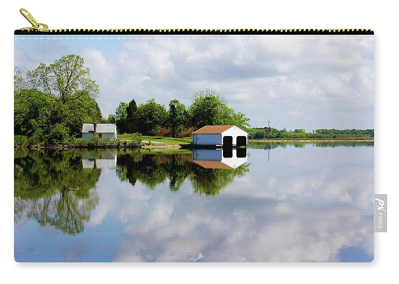 Blackwater River Zip Pouch featuring the photograph Boathouse Reflected in River on a Beautiful Day by Charles Floyd