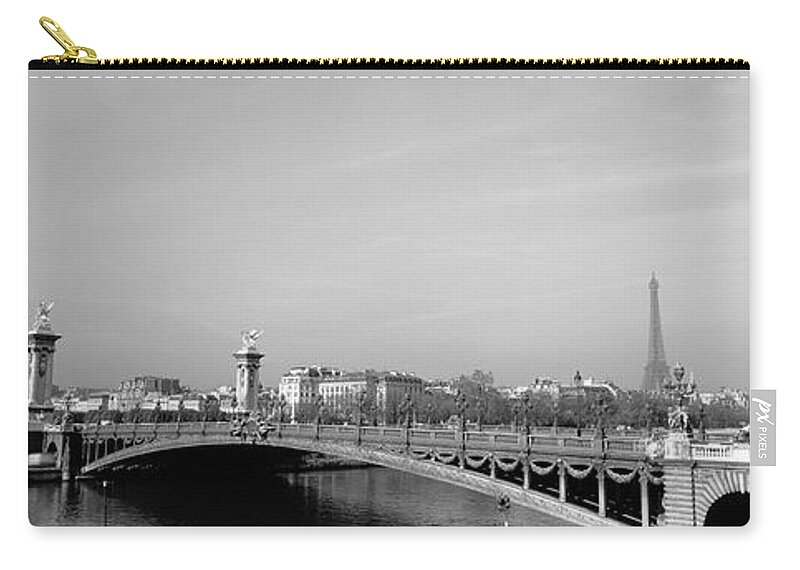 Alexandre Iii Bridge Arch Bridge Building Exterior Building Structure Cloud Black And White Day Eiffel Tower Europe France Horizontal Mediterranean Countries Nobody Outdoors Panoramic Paris Photography River Sky Structure Tower Water Architecture Capital Cities City Location Travel Destinations Zip Pouch featuring the photograph Bridge over a river, Alexandre III Bridge, Eiffel Tower, Paris, France by Panoramic Images