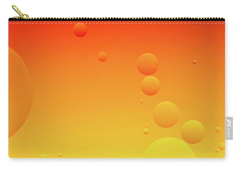 Connection Zip Pouch featuring the photograph Bright abstract, yellow and orange background with flying bubbles by Michalakis Ppalis