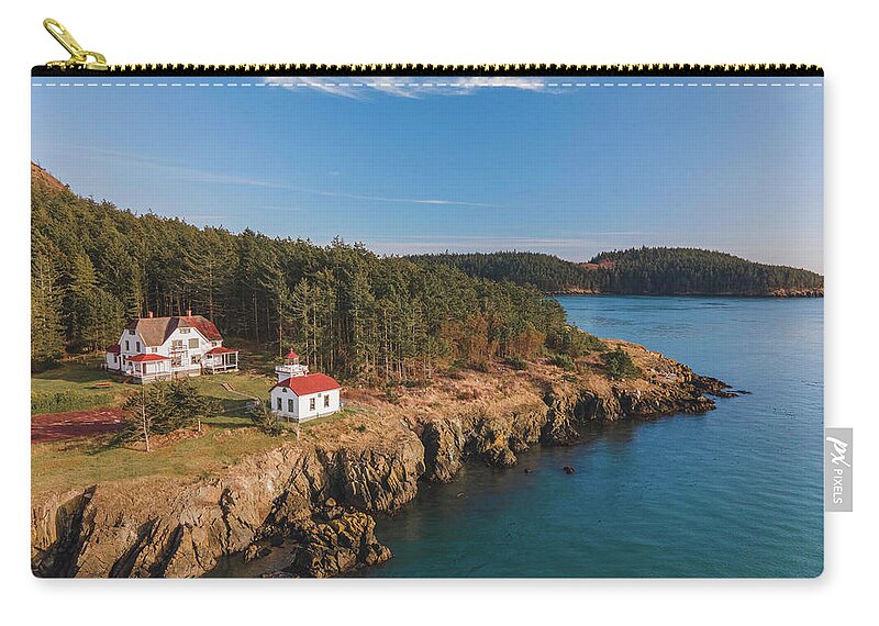 Lighthouse Zip Pouch featuring the photograph Burrows Island Lighthouse by Michael Rauwolf