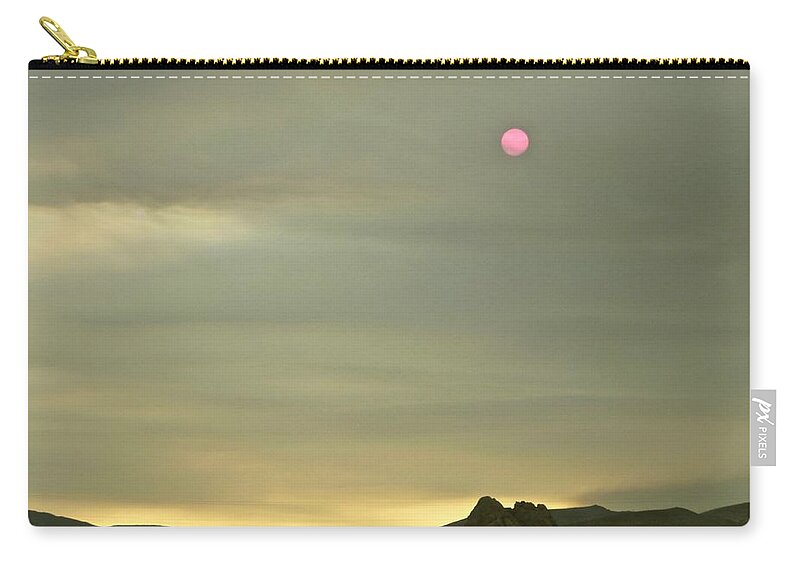 Landscapes Zip Pouch featuring the photograph By The Light of The Red Sun by Amelia Racca