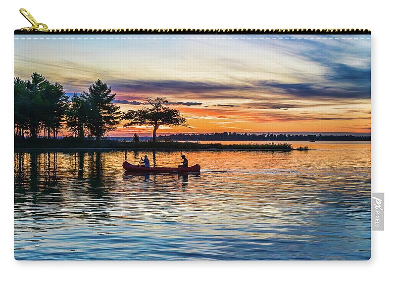 Higgins Lake Carry-all Pouch featuring the photograph Canoe at Sunset by Joe Holley