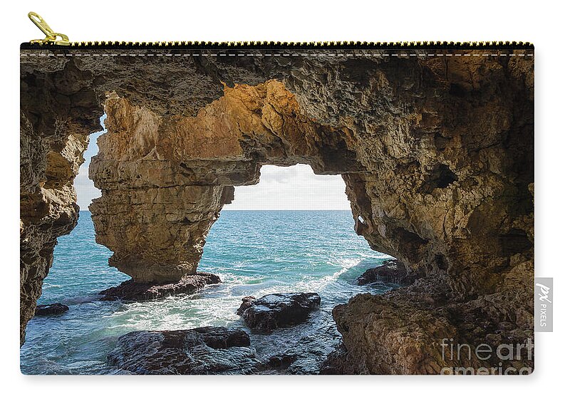 Coast Zip Pouch featuring the photograph Cave on the Mediterranean coast, Cova del Arcs by Adriana Mueller