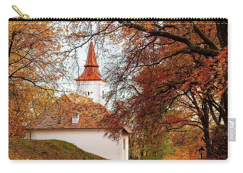 Architecture Carry-all Pouch featuring the photograph Chapel hidden by autumn forest by Viktor Wallon-Hars