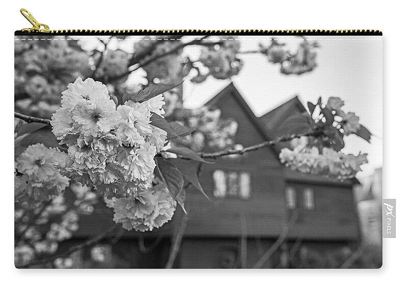 Salem Zip Pouch featuring the photograph Cherry Blossoms in front of the Salem Witch House Salem MA Black and White by Toby McGuire