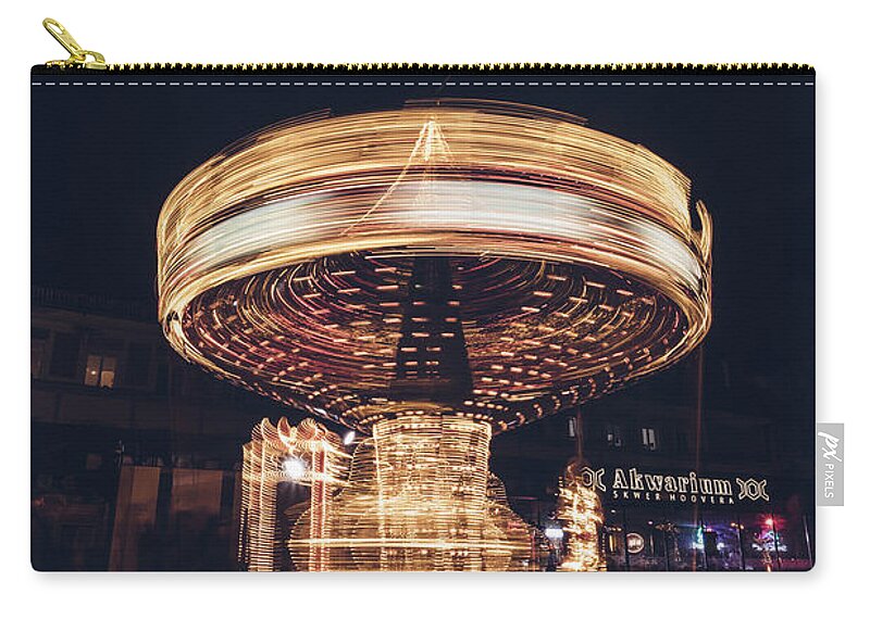 Illuminations Carry-all Pouch featuring the photograph Christmas carousel on the streets of Warsaw. Fire Wheel by Vaclav Sonnek