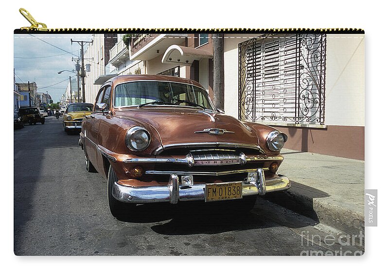 Cuba Zip Pouch featuring the photograph Classic 1950s Plymouth in Santiago Cuba by James Brunker