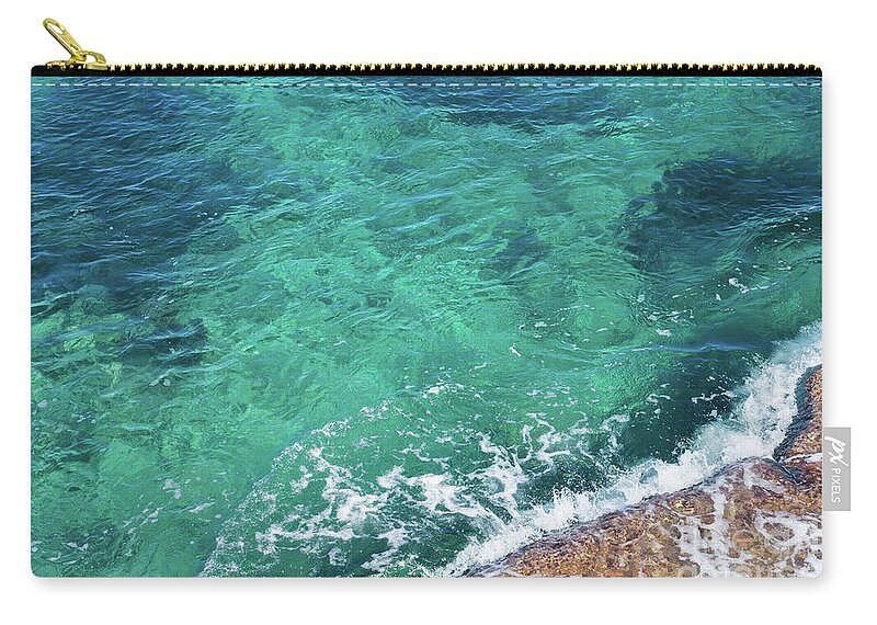 Mediterranean Sea Zip Pouch featuring the photograph Clear seawater flows over the rocks 1 by Adriana Mueller