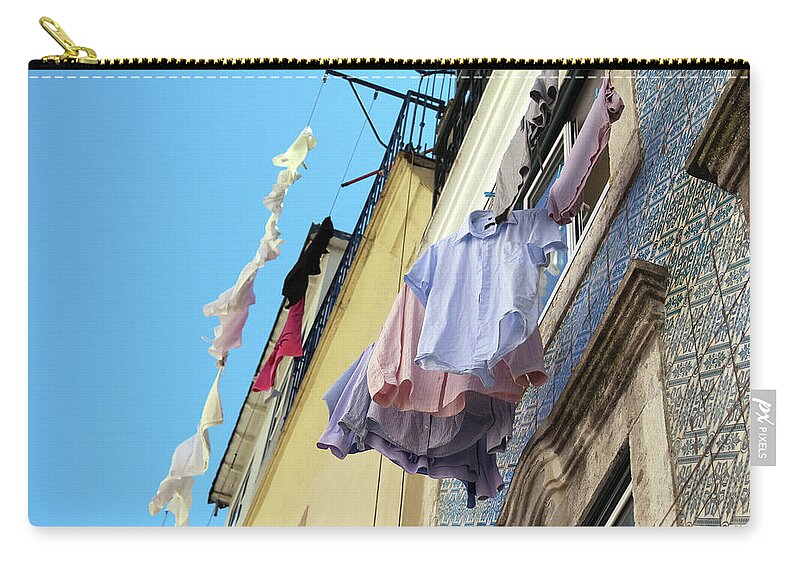 Hanging Zip Pouch featuring the photograph Clothes hanging by Fabiano Di Paolo