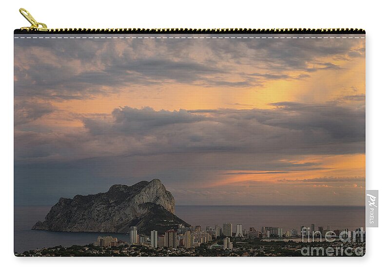 Sunset Zip Pouch featuring the photograph Clouds on the Mediterranean coast in Calpe by Adriana Mueller