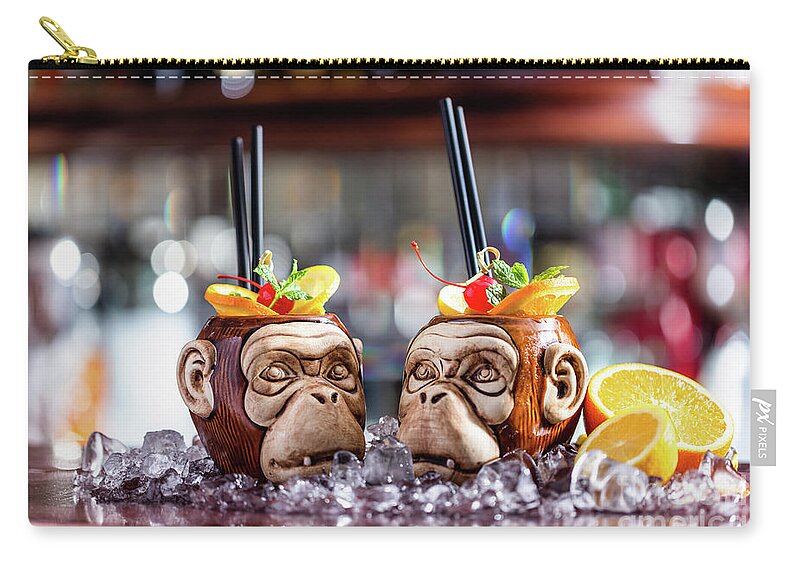 Cocktail Zip Pouch featuring the photograph Coctail in monkey mugs on bar counter by Michal Bednarek