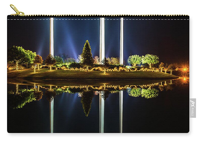 Andy Crawford Zip Pouch featuring the photograph Crosses in reflection by Andy Crawford