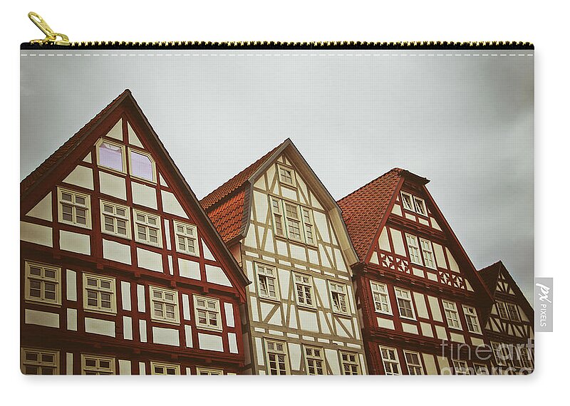 Architecture Zip Pouch featuring the photograph Cute historical half-timbered houses in Melsungen, Germany by Mendelex Photography