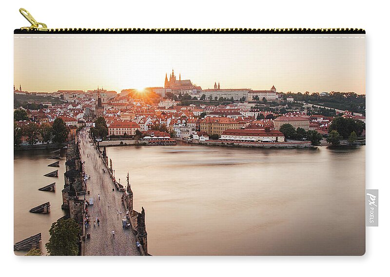 Castle Zip Pouch featuring the photograph Czech capital city with Charles bridge at sunset by Vaclav Sonnek