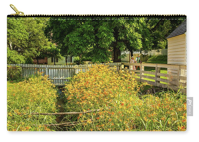Colonial Williamsburg Zip Pouch featuring the photograph Daylilies in the Spring by Lara Morrison