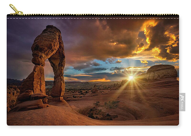 Moab Zip Pouch featuring the photograph Delicate Arch Sunset by Michael Ash